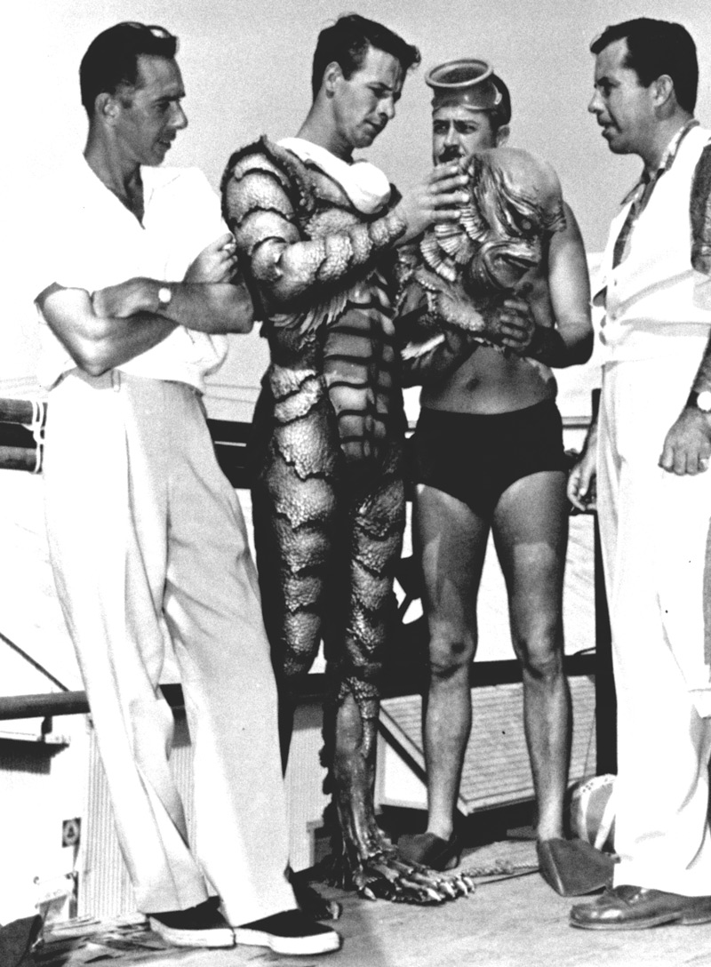 Creature from the Black Lagoon, Universal-International, 1954.  From left to right, director Jack Arnold, actor Ricou Browning, make up man Jack Kevan and make up department head Bud Westmore.  Browning, then in his early 20s and still a student at Florida State University, came by the part of the