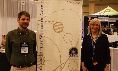 Matthew Johnson and Julie Czerneda at the SFWA booth