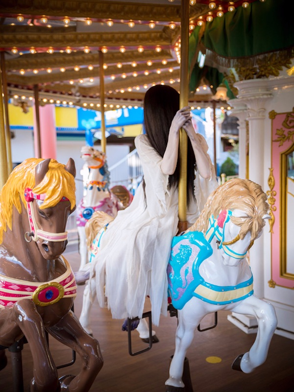 Sadako on a carousel horse