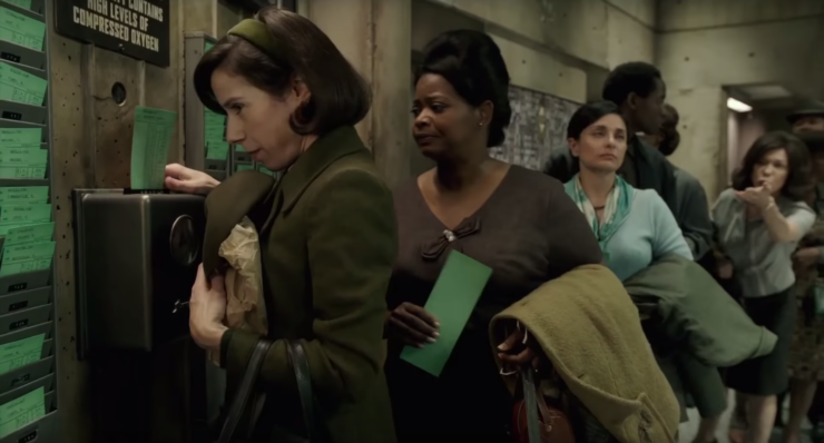 Elisa (Sally Hawkins) and Zelda (Octavia Spenser) using a punch clock in The Shape of Water