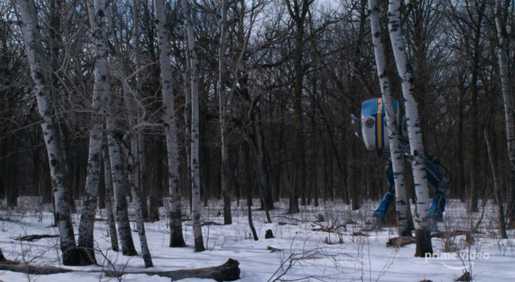 Robot stands behind trees in Tales From the Loop