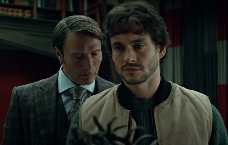 Mads Mikkelson and Hugh Dancy in Hannibal, Hannibal over Will's shoulder, staring at his back