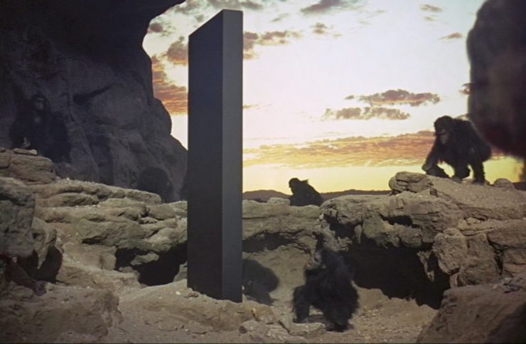 Apes surround the monolith in 2001 A Space Odyssey