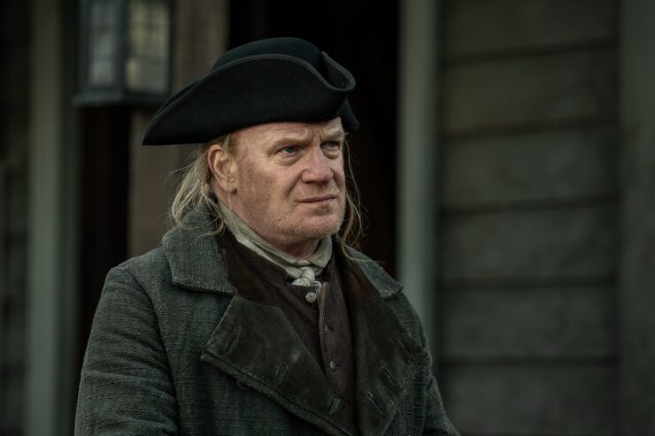 Still from Outlander, Season 7 Episode 1: A Life Well Lost (Mark Lewis Jones as Thomas Christie)
