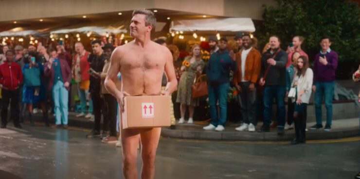 Good Omens 2, Gabriel walking through the street naked, with a cardboard box in front of his bits