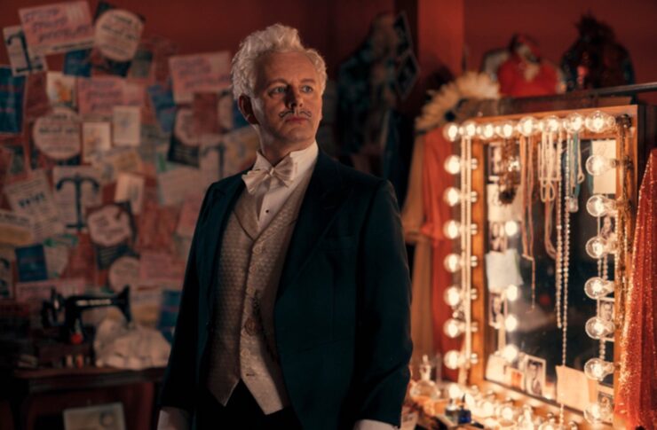 Michael Sheen as Aziraphale in costume as The Magical Mr. Fell on Good Omens. 