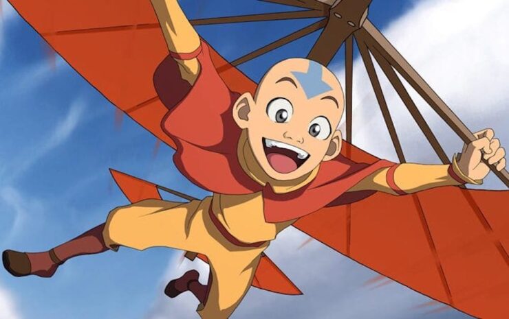 Aang glides using his flying staff in Avatar: The Last Airbender