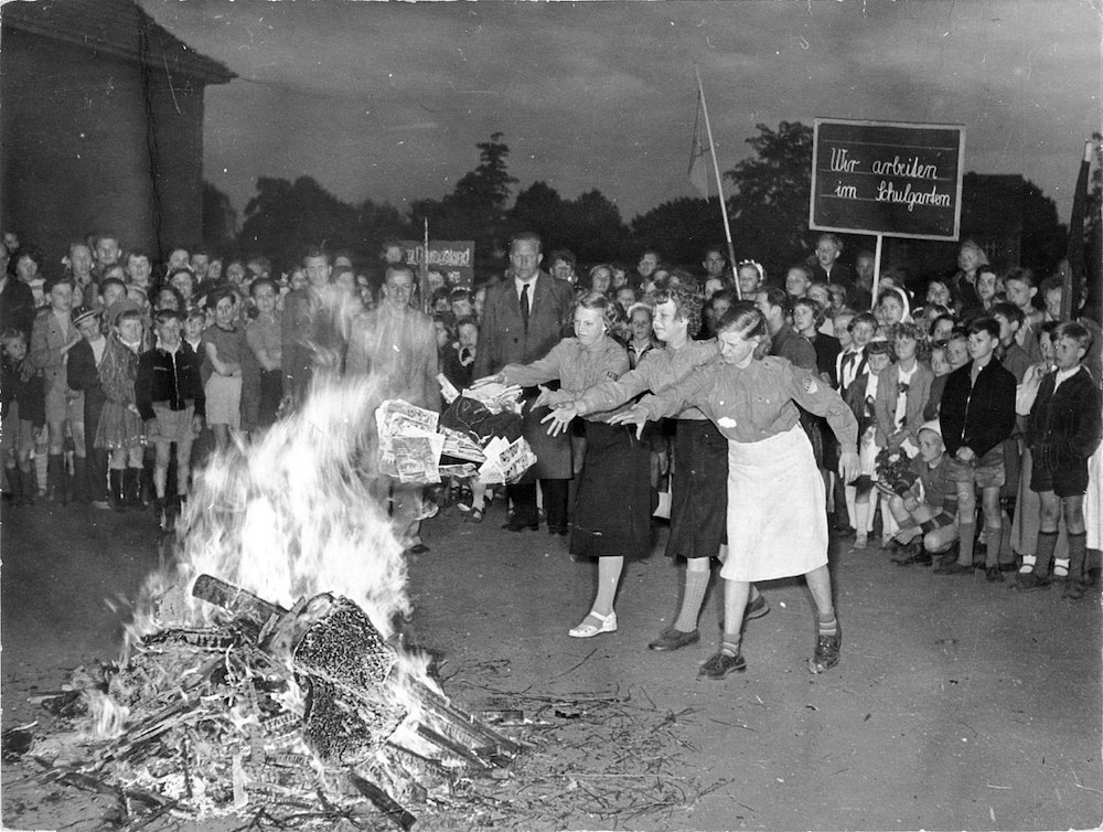 Photograph of children participating in a book burning in Berlin on June 1, 1955.
