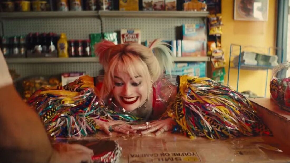 Harley Quinn at a bodega counter in a screenshot from Birds of Prey