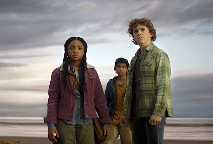 The three leads of Disney's Percy Jackson stare pensively into the distance
