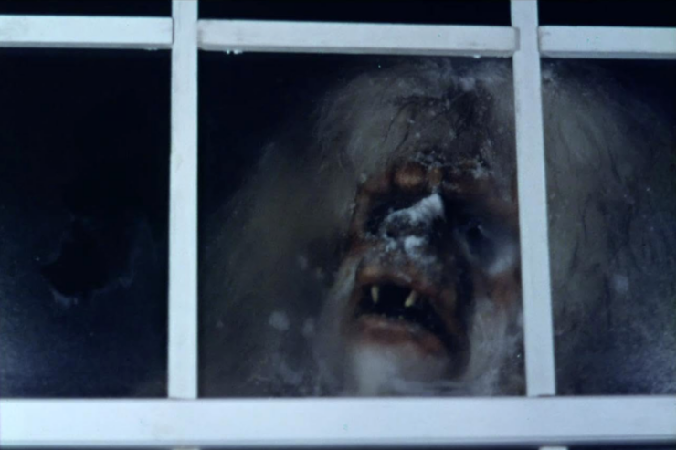 Scene from the 1977 TV movie Snowbeast: a Yeti-like creature peers through a window.
