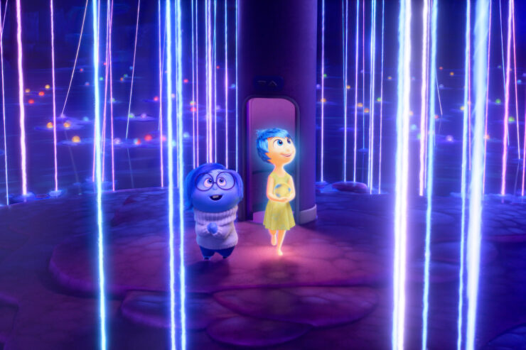 Sadness (voice of Phyllis Smith) and Joy (voice of Amy Poehler) deliver key memories in Inside Out 2.