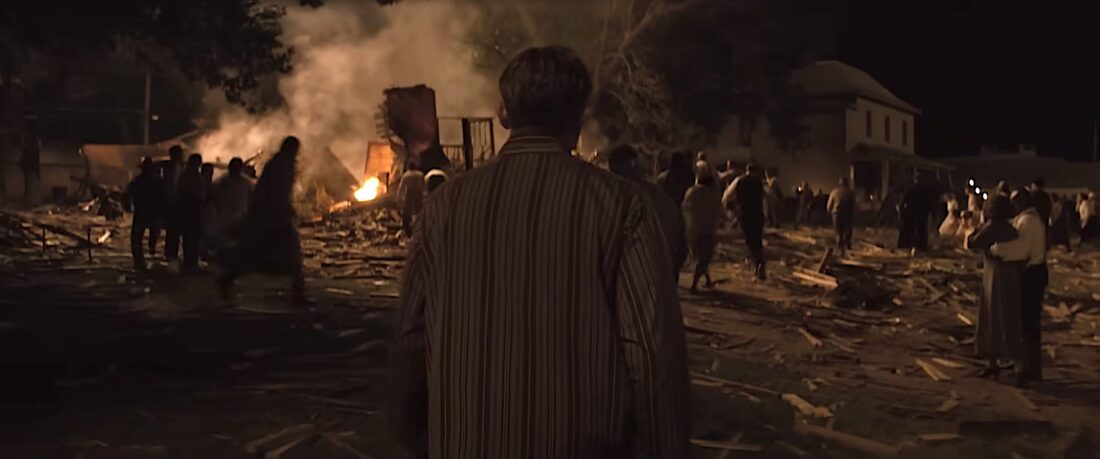 People run through the wreckage after a bomb explodes in Martin Scorsese's Killers of the Flower Moon