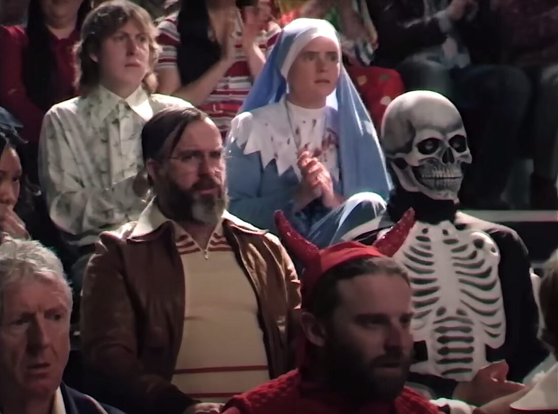 The studio audience watches Night Owls with Jack Delroy in Late Night with the Devil.