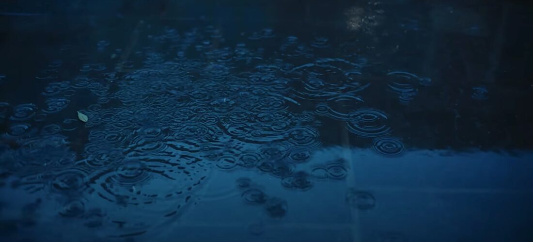 A close-up image of raindrops on a pond in Christopher Nolan's Oppenheimer