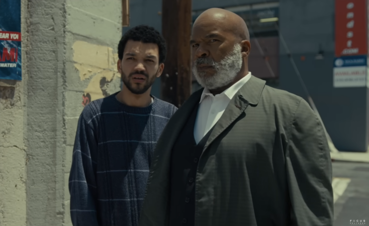 Scene from The American Society of Magical Negroes, featuring Justice Smith and David Alan Grier
