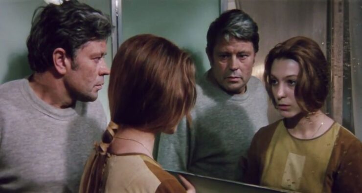 Scene from Solaris (1972): Kris and Hari look at their reflections in a mirror