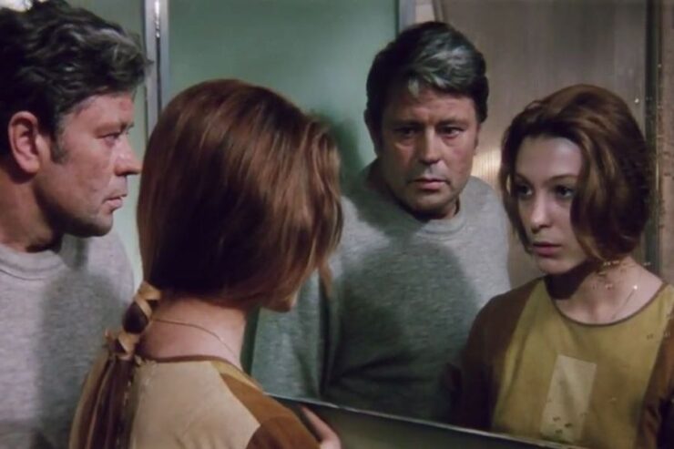 Scene from Solaris (1972): Kris and Hari look at their reflections in a mirror