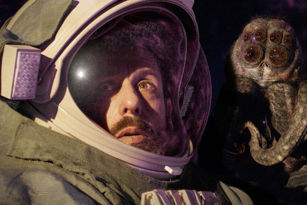 A scene from Spaceman (2024): astronaut Jakub (Adam Sandler) and the alien-spider Hanus