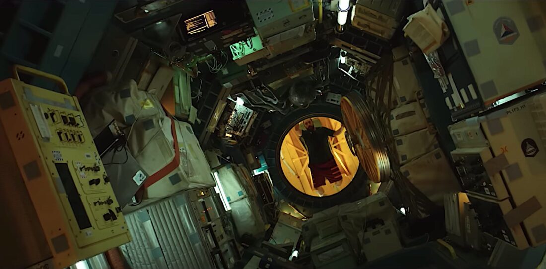 Adam Sandler surveys his cluttered interstellar ship in Spaceman