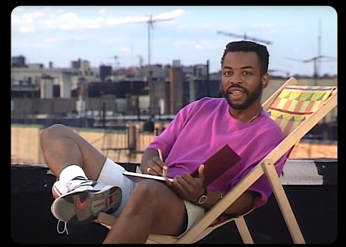 Reading Rainbow host LeVar Burton sits in a deck chair on a rooftop "tar beach" in Upper Manhattan.