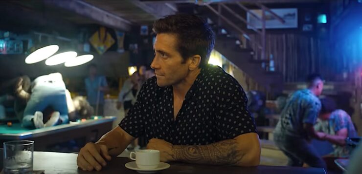 Elwood Dalton (Jake Gyllenhaal) is annoyed when a bar fight interrupts his coffee break in Dough Liman's Road House reboot.