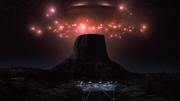 An alien spacecraft hovers over Devil's Tower in a scene from Close Encounters of the Third Kind