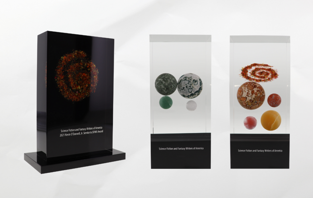 three different versions of the Nebula Award statue