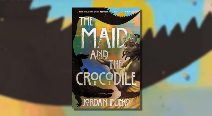 Cover of The Maid and the Crocodile by Jordan Ifueko, showing a person wearing a yellow dress and a garland, holding out their hand. The silhouette of a crocodile is curled around the title of the novel.