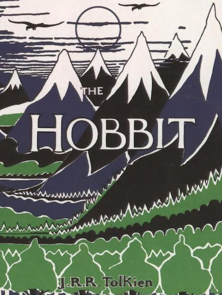 Cover of The Hobbit, showing a forest and grey mountains, with a moon and several flying creatures in the sky.