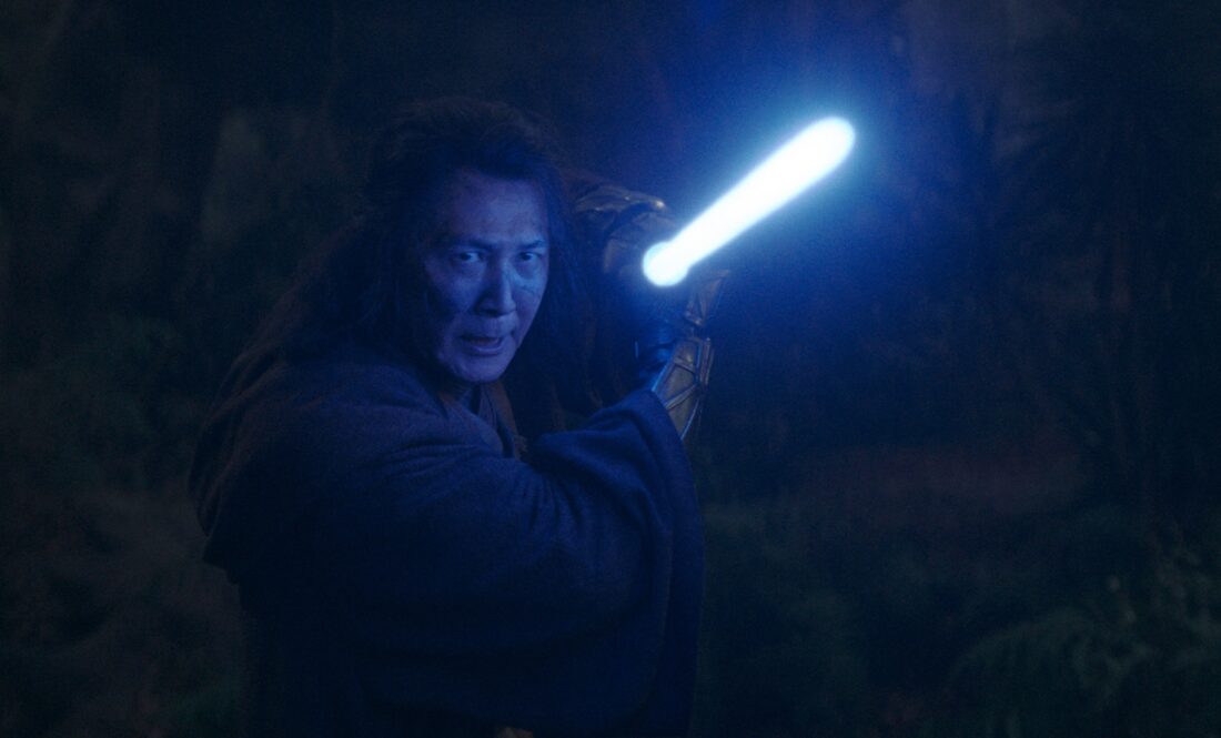 Master Sol (Lee Jung-jae) with lightsaber drawn in Lucasfilm's THE ACOLYTE, season one, "Night"