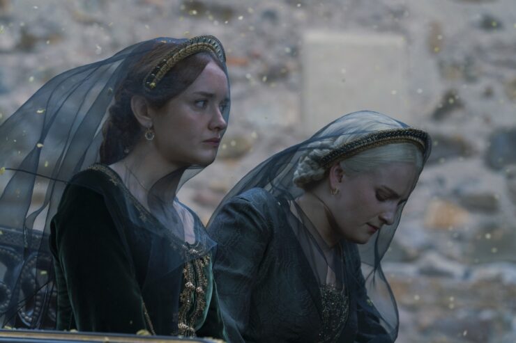 Alicent Hightower (Olivia Cook) and Helaena (Phia Saban) wear mourning veils in House of the Dragon, Season 2 Episode 2