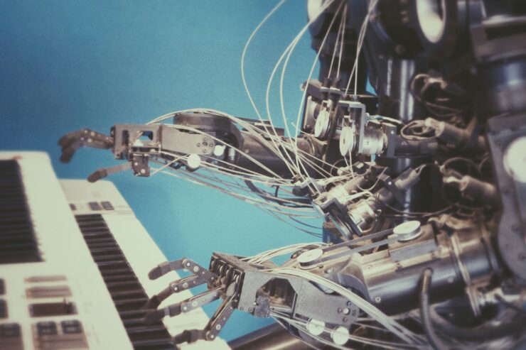 Close-up robot playing a piano