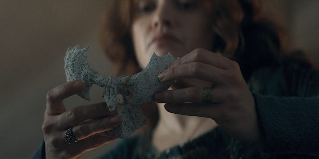 Alicent (Olivia Cooke) considers a model dragon in House of the Dragon.