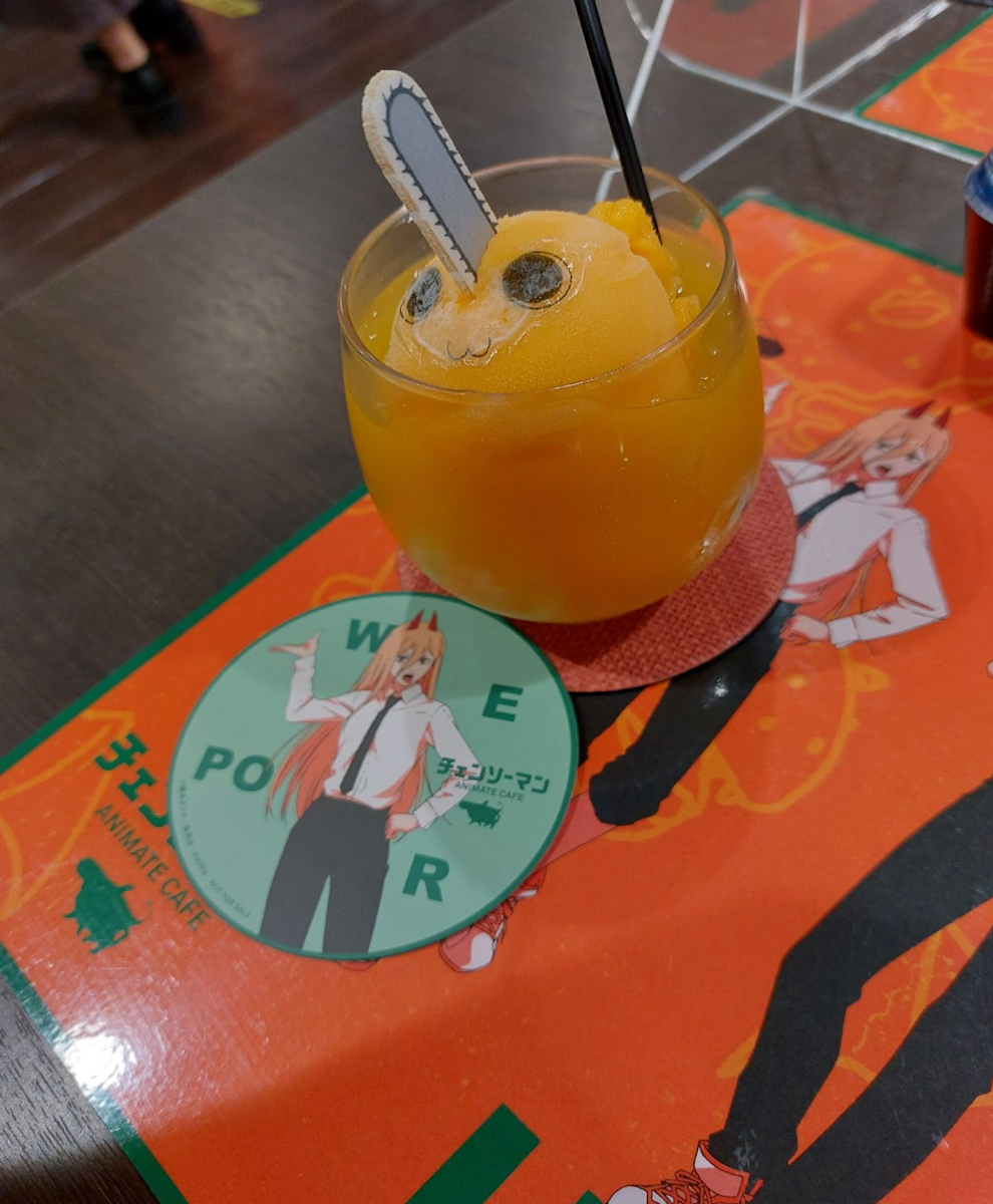 Pochita-themed orange slushie from a Chainsaw Man pop-up cafe in Japan