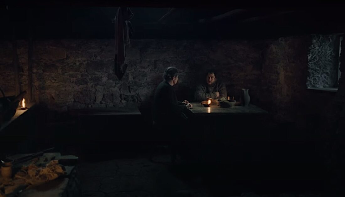 Mother Gänglin (Maria Hofstätter) and Wolf (David Scheid) eat dinner by candlelight in The Devil's Bath.