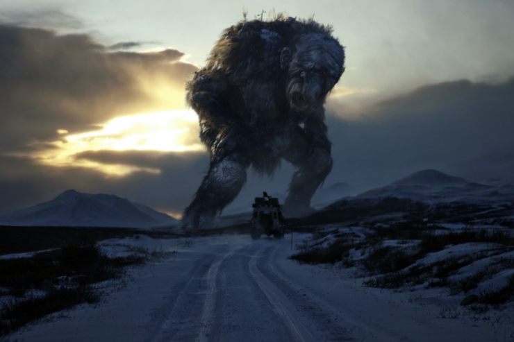 A scene from the movie Trollhunter: a large troll stands above a jeep on a dirt road