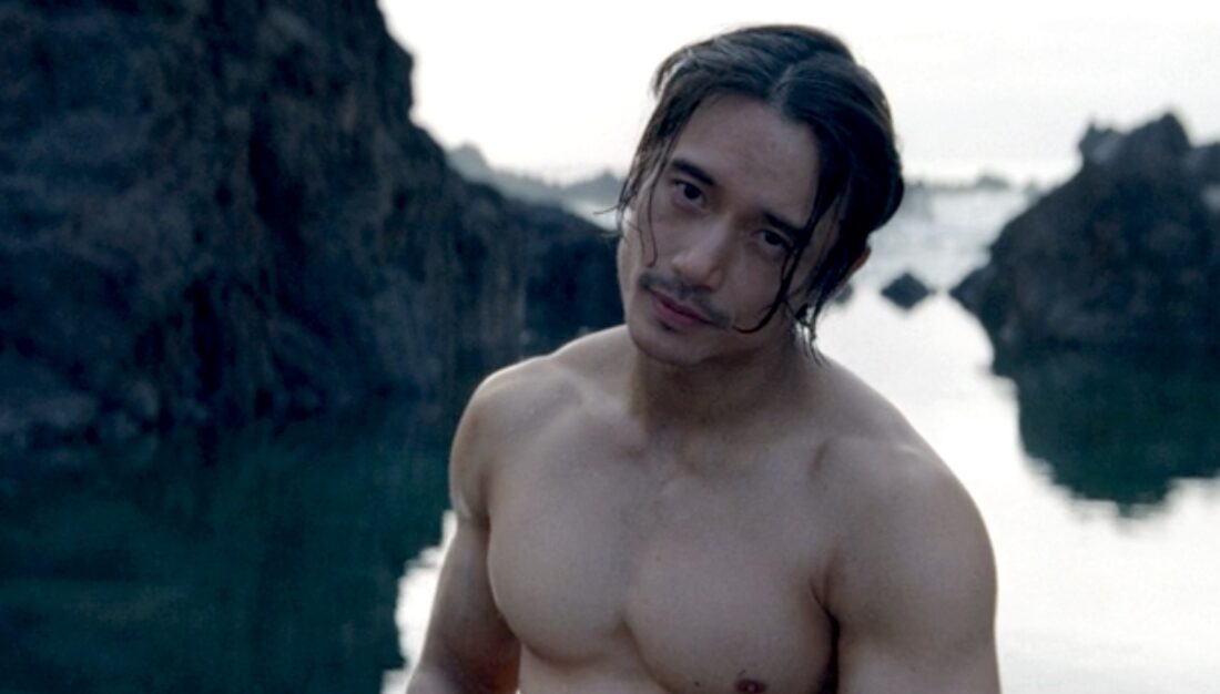 Manny Jacinto as Qimir, shirtless by a tidepool in The Acolyte, "Teach/Corrupt"