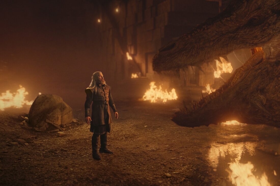 A scene from House of the Dragon, season 2 episode 7: Hugh (Kieran Bew) stands before a dragon