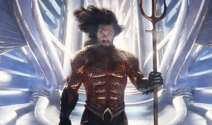 A scene from Aquaman and the Lost Kingdom: Aquaman (Jason Momoa) holds a trident.