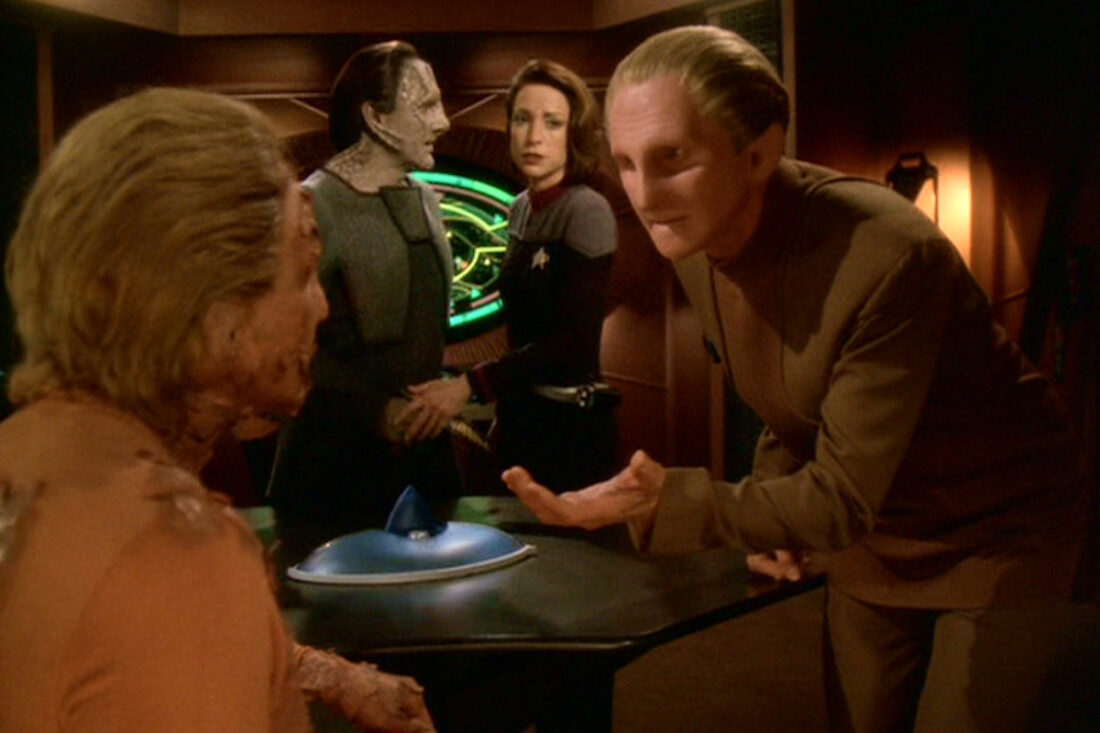 Odo extends his hand to the Nameless Shapeshifter in a scene from Star Trek: Deep Space Nine "What You Leave Behind"