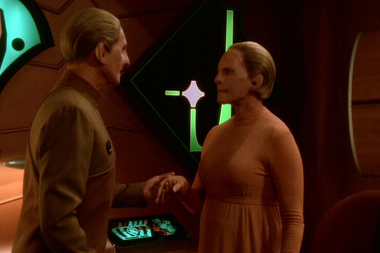 Odo and the Nameless Shapeshifter hold hands in a scene from Star Trek: Deep Space Nine "What You Leave Behind"