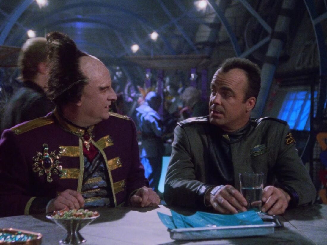 A scene from Babylon 5 "A Voice in the Wilderness, Part 1": Mollari and Garibaldi talk at a bar.