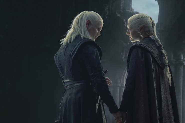 A scene from House of the Dragon season 2 episode 8: Daemon (Matt Smith) and Rhaenyra (Emma D'Arcy) stand together holding hands