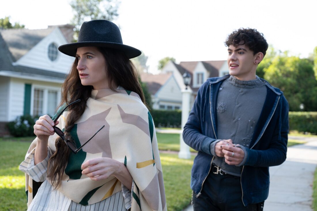 (L-R): Teen (Joe Locke) and Agatha Harkness (Kathryn Hahn) walking down the sidewalk in Marvel Television's AGATHA ALL ALONG