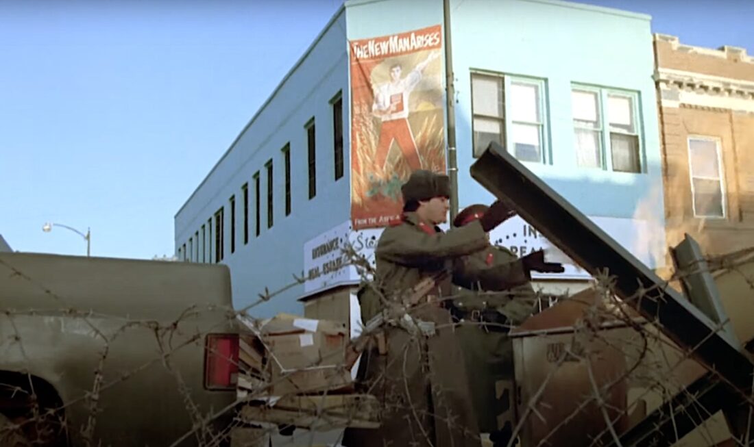 The invaders raise a barbed-wired fence in John Milius' Red Dawn.