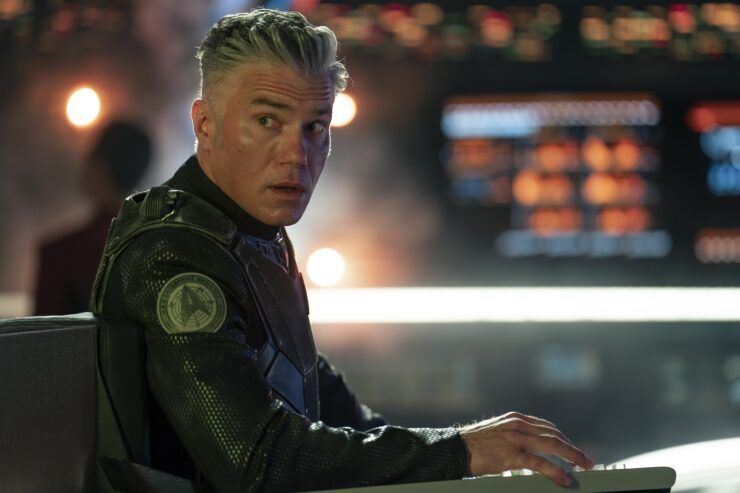 Anson Mount as Pike in the captain's chair lokoing worried in Star Trek: Strange New Worlds, episode 1, season 3, streaming on Paramount+, 2025.