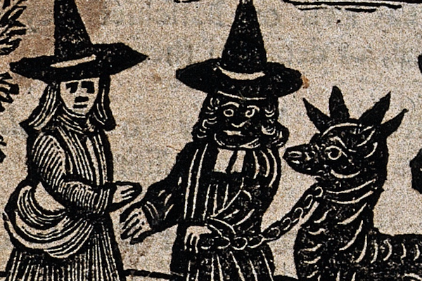 Detail from a woodcut depicting two witches and a beast with a chain and collar attached to its neck.