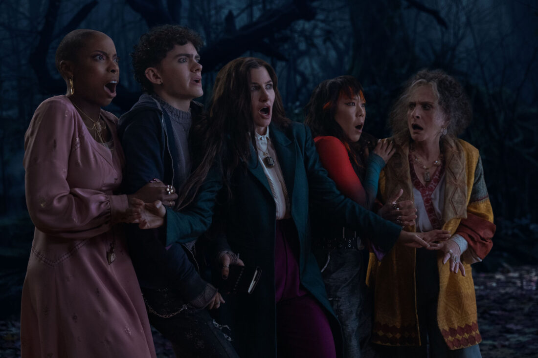 (L-R) Jennifer Kale (Sasheer Zamata), Teen (Joe Locke), Agatha Harkness (Kathryn Hahn), Alice Wu-Gulliver (Ali Ahn), and Lilia Calderu (Patti LuPone) all standing side by side looking horrified in Agatha All Along, "If I Can't Reach You / Let My Song Teach You"