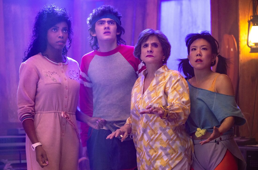 (L-R) Jennifer Kale (Sasheer Zamata), Teen (Joe Locke), Lilia Calderu (Patti LuPone) and Alice Wu-Gulliver (Ali Ahn) looking worried in Agatha All Along, episode 5